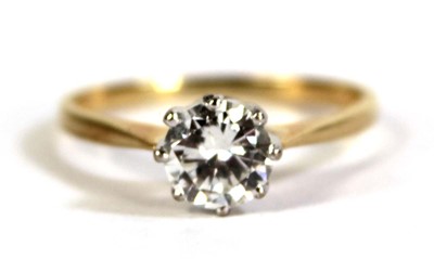 Lot 791 - An 18ct yellow gold ring set brilliant cut...