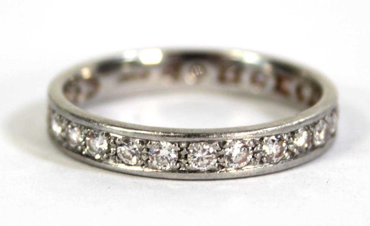 Lot 792 - A platinum full eternity ring set small...