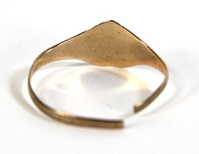 Lot 802 - A yellow metal heart shaped signet ring, 1.1 gms