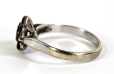 Lot 803 - A 9ct white gold cluster ring set diamond and...