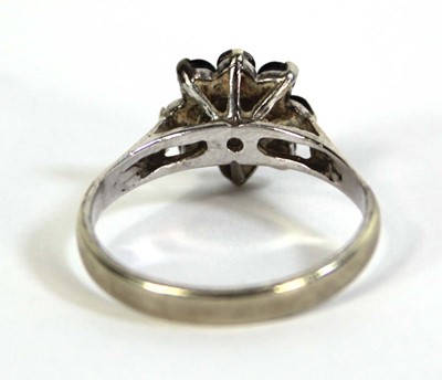 Lot 803 - A 9ct white gold cluster ring set diamond and...