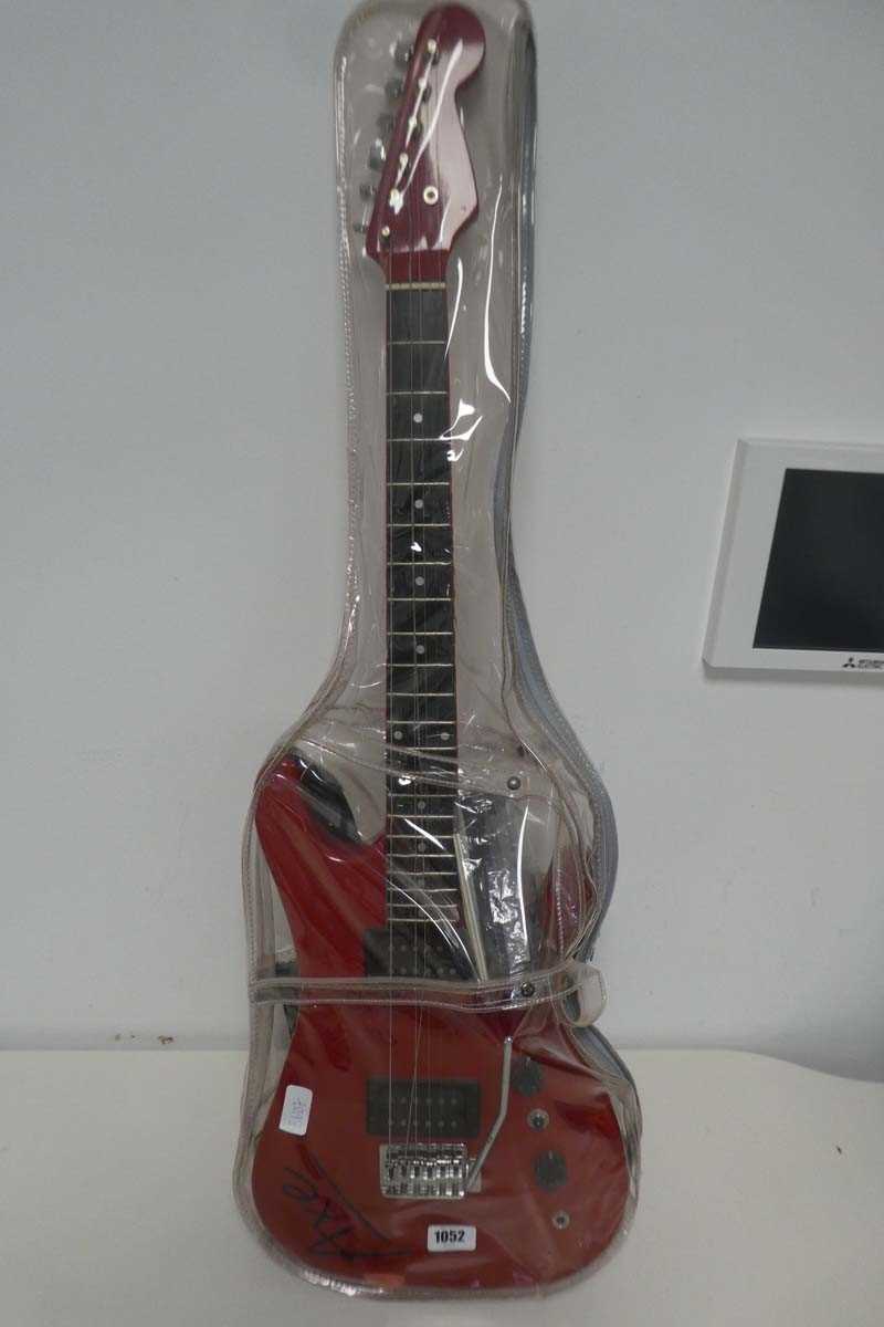 Lot 1052 - Red Axe electric guitar with 2 instructional...