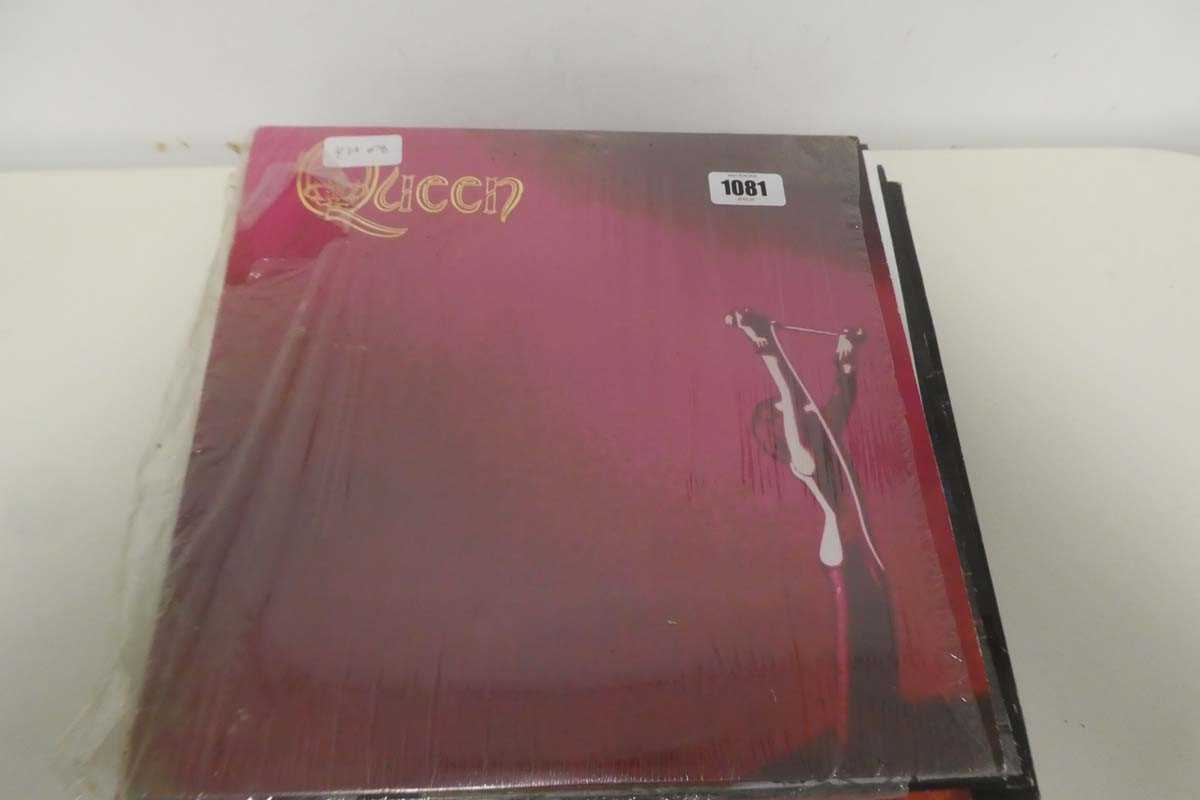 Lot 1081 - Box and stack of vinyl albums incl. Queen,...