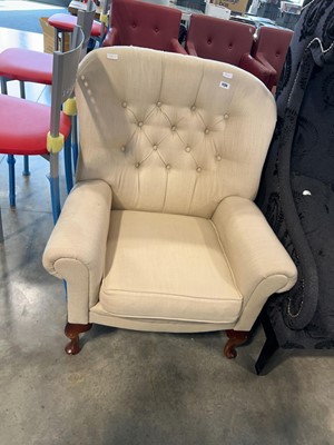 Lot 1136 - Button back cream armchair