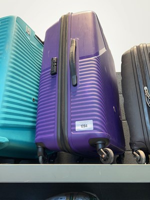 Lot 1284 - American Tourister suitcase in purple