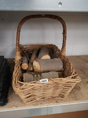 Lot 2077 - Wicker single handled basket containing cut logs
