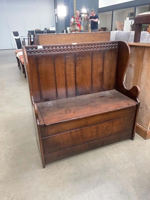 Lot 5125 - Caved oak settle with storage under